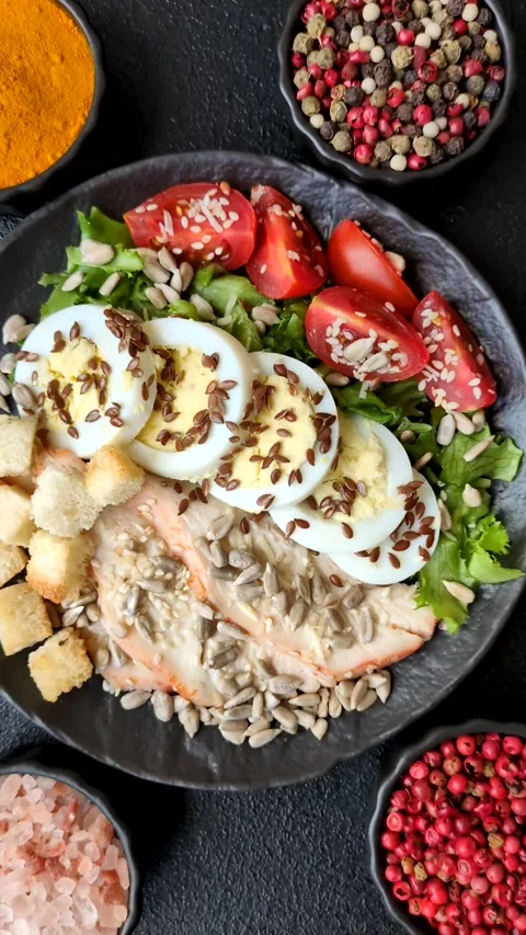 Bowl with caesar salad with chicken, parmesan cheese, tomatoes, croutons, lettuc Stock Footage 308531493