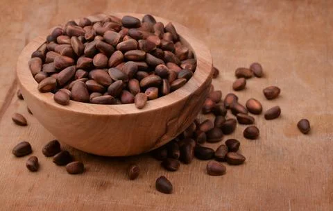 Bowl of cedar nuts Stock Photos