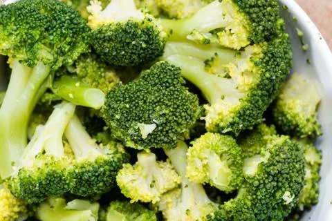 Bowl with cooked broccoli Stock Photos