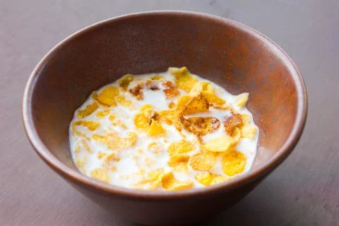 Bowl with corn flakes on the table Stock Photos