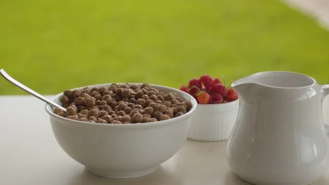 Bowl of cornflakes and raspberry Stock Footage 137627146