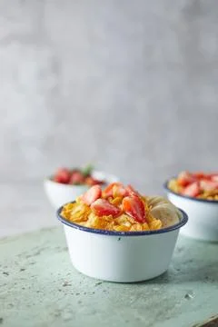 Bowl with cornflakes on background.. Stock Photos