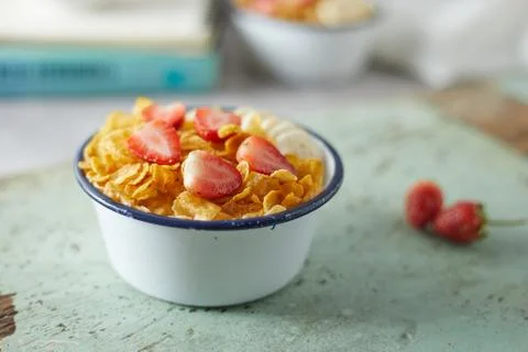 Bowl with cornflakes on background.. Stock Photos