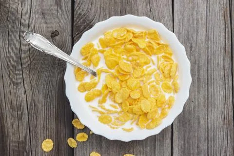 Bowl of cornflakes on the table Stock Photos