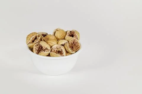 Bowl of dried figs on white Stock Photos