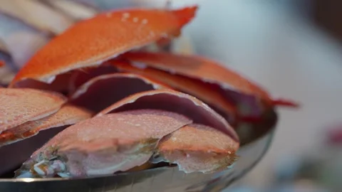A bowl of empty orange crab shells Stock Footage 314320456