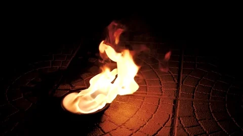 Bowl of fire in the street at night. Fire show Stock Footage