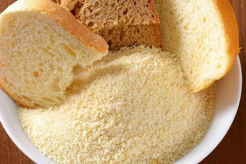 Bowl of flour with bread pieces inside Stock-Fotos