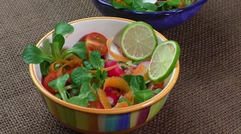 Bowl of fresh vegetable salad on jute table cloth 스톡 동영상 59371649