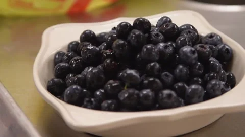 A bowl of fruit sitting on a table Stock Footage 155460709