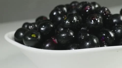 A bowl full of Java plum fruit front push 4k short Stock Footage 252206889