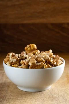 Bowl full of walnut kernels Stock Photos