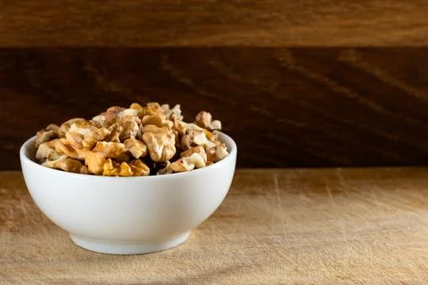 Bowl full of walnut kernels Stock Photos