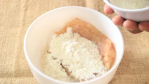 A bowl of ground meat plus flour. someone makes a mixture of meat and flour Stock Footage 334647055