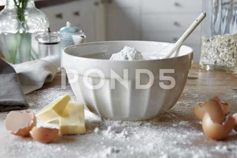 Bowl Of Mixing Dough In Messy Kitchen