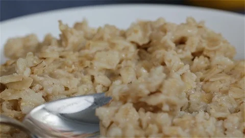 Bowl of Oatmeal Closeup with Spoon Stock Footage 101088241