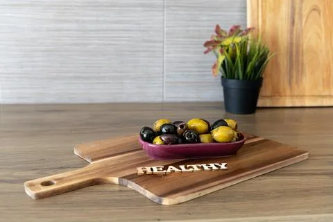 Bowl of olives on the table Stock Photos