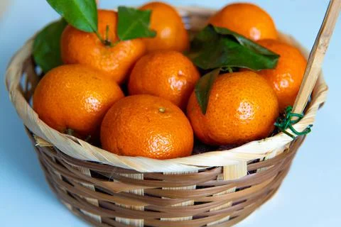 A bowl of oranges on a table Stock Photos