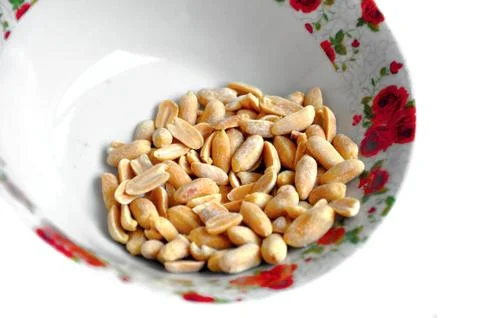 Bowl of peanuts Stock Photos