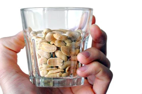 Bowl of peanuts Stock Photos