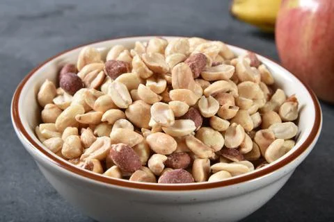 Bowl of peanuts Stock Photos
