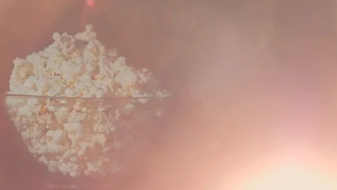 Bowl of pop corn, 3d viewing glasses in dark background and projector beam glare Video stock 111762209