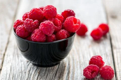 Bowl with ripe raspberry. Stock Photos