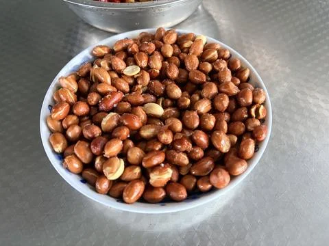 Bowl of Roasted Peanuts on Tabletop Stock Photos