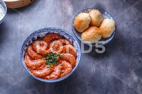Bowl of shrimps in spicy tomato sauce, singaporean cuisine, copyspace Stock Photos