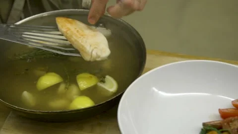A bowl of soup and a spoon on a table Stock Footage 155450137