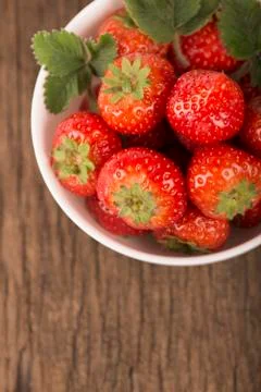 Bowl with strawberries Stock Photos