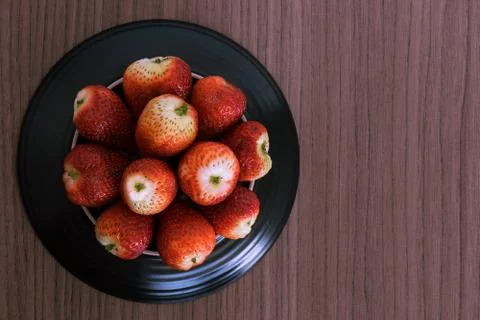 Bowl of strawberries Stock Photos