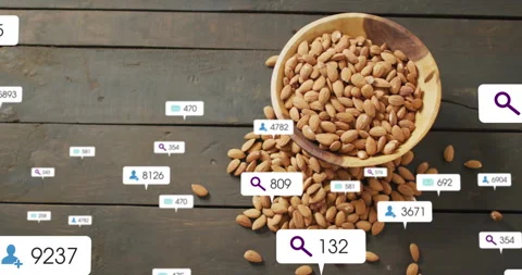 Bowl tipping spilling almonds, bubbles popping, counts rising then fading Stock Footage 310433738