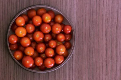 Bowl of tomatoes Stock Photos