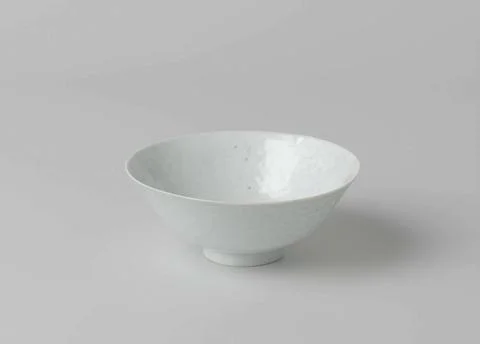 Bowl with Translucent Flower Scrolls. Wide bowl of porcelain, covered with... Stock Photos