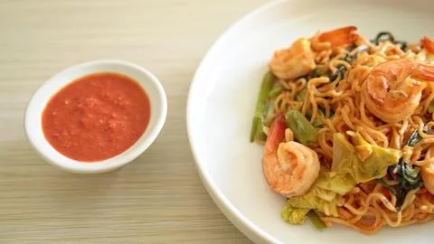 Bowl of vegetable fried rice with side of tomato sauce Stock Photos