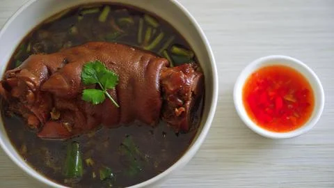 Bowl of vietnamese beef stew with herbs and chili sauce Stock Photos
