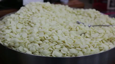 Bowl of white milk chocolate chips Stock Footage 59771257