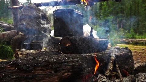 Bowler on a camp fire. Stock Footage 90256398