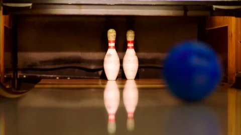 Bowling ball knocking two pins down Stock Footage 81183926