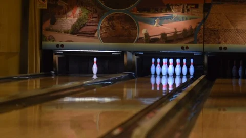 Bowling ball knocks down all pins - strike. Bowling ball on the track Stock Footage 122593487