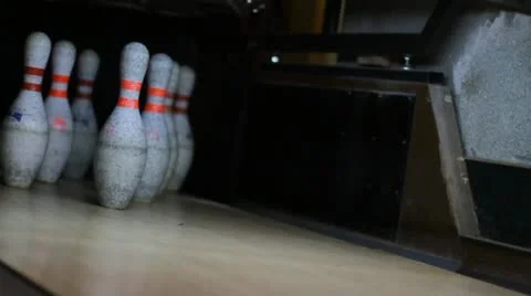Bowling ball knocks down skittles Stock Footage 12372505