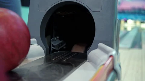 Bowling ball return system close-up. Hand picks up the bowling ball Stock Footage 147622042