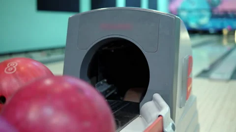 Bowling ball return system close-up. Girl takes a bowling ball Stock Footage 147669539