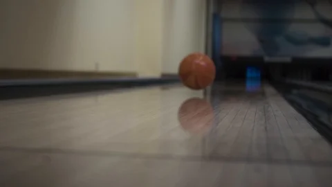 Bowling ball rolling on the track Stock Footage 99044288
