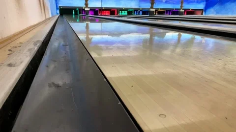 Bowling ball rolls and knocks down pins Stock Footage 122384214