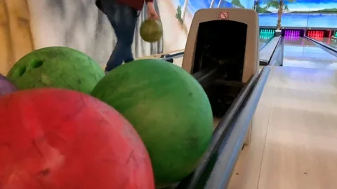 Bowling ball rolls out for other players Stock Footage 122295076