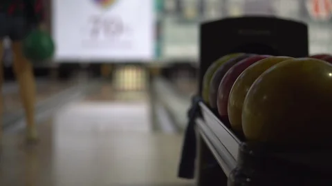Bowling balls close-up on the background of a bowler girl throwing a ball Stock-Footage 120467697