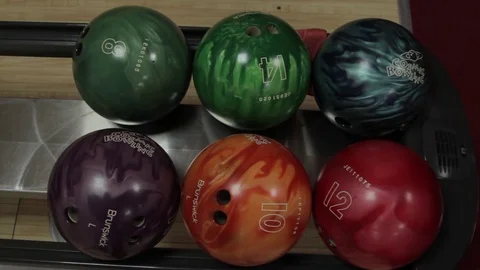 Bowling. bowling balls. player takes ball for playing bowling Stock-Footage 80977694