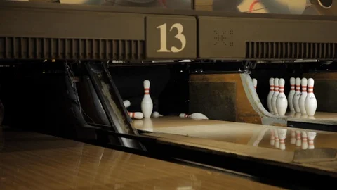 Bowling Pins Being Knocked Down by Bowling Ball Stock Footage 114016572